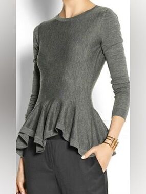 Alexander McQueen grey Peplum sweater.